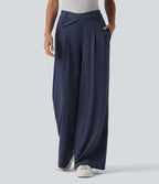 Pantalon tailleur évasé asymétrique taille mi-haute avec poches