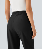 Pantalon tailleur taille haute froncé coupe fuselée avec poches et fermeture éclair invisible sur le côté