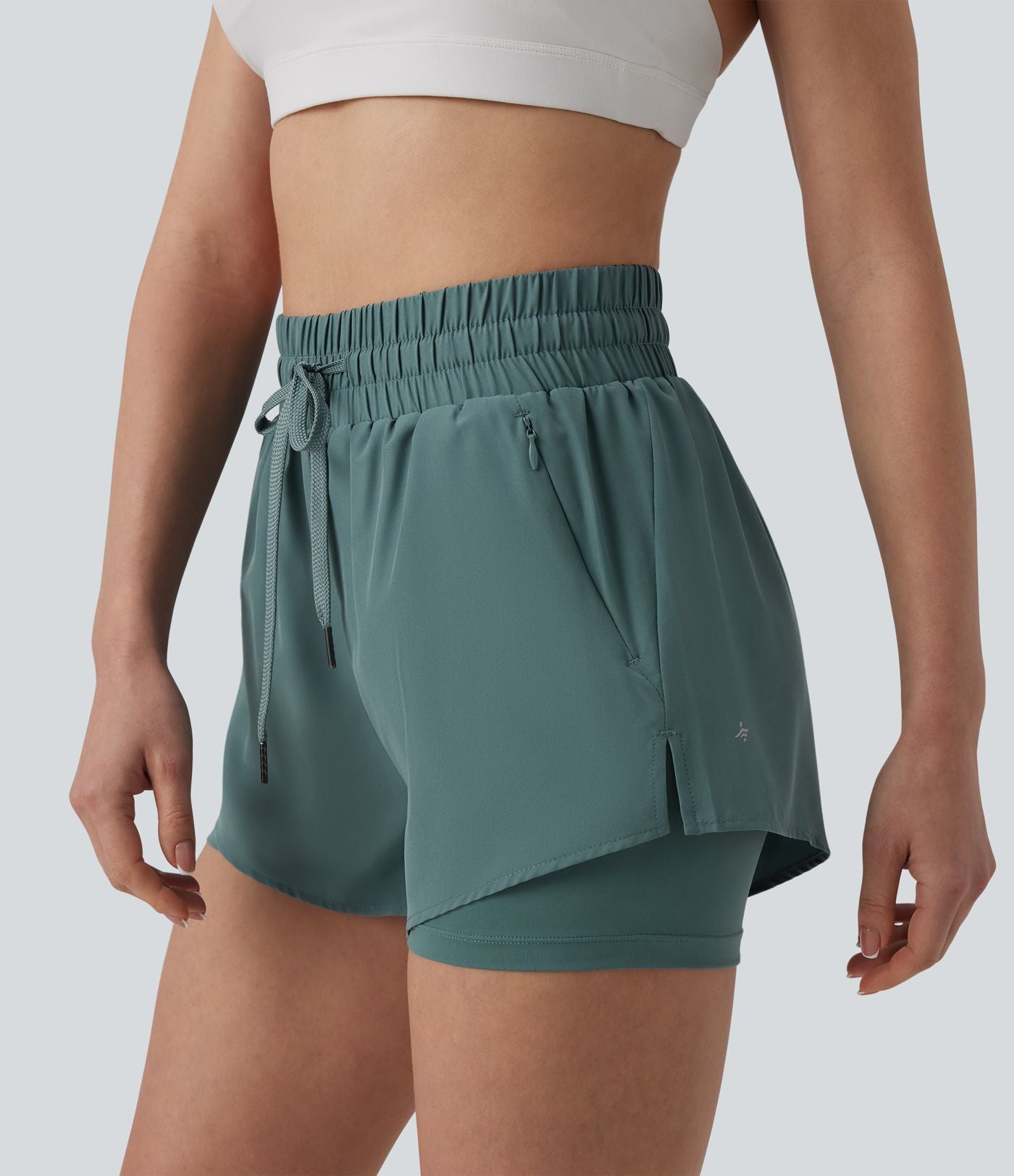 Short running 2-en-1 taille haute avec cordon de serrage et poches