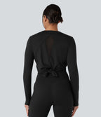 Top de sport running col rond mesh contrastant liens dans le dos manches longues