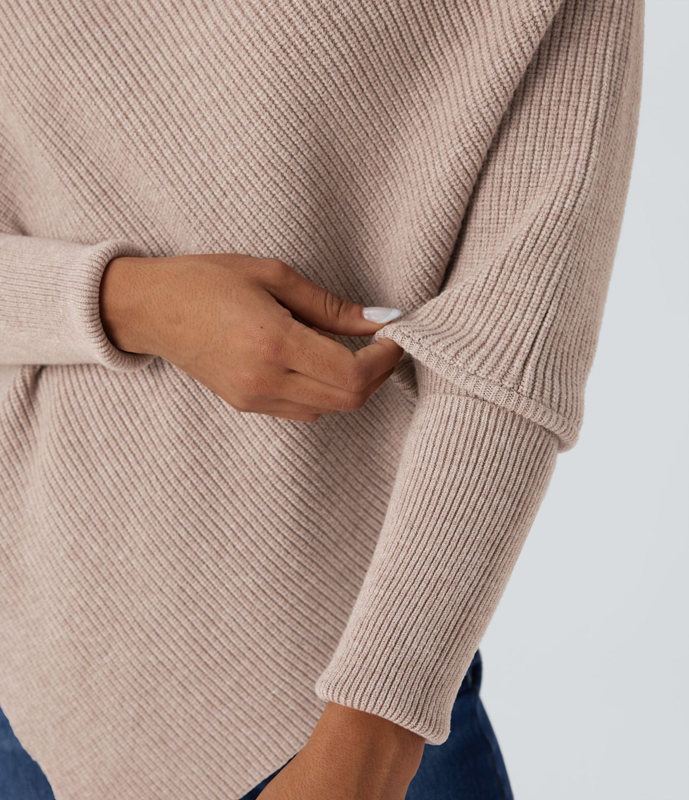 Pull cape décontracté col roulé manches chauve-souris ourlet asymétrique