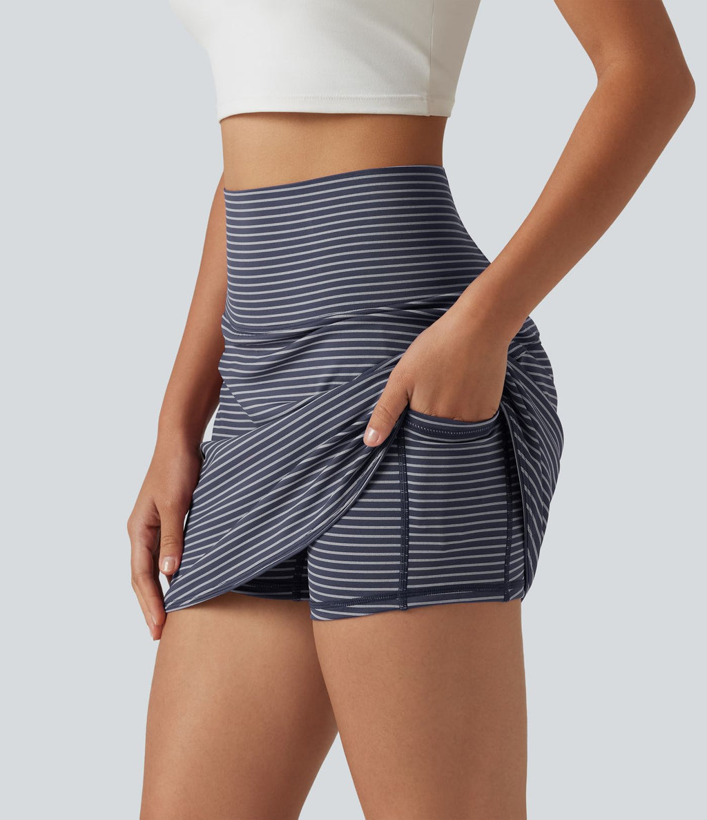 Mini-jupe de golf 2 en 1 à rayures, taille ultra haute, effet ventre plat, ourlet arrondi et poches