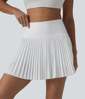 Breezeful™ Jupe mini de tennis plissée 2 en 1 taille haute séchage rapide avec poches