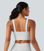 Brassière de sport push-up rayée à maintien léger, avec coussinets fixes, idéale pour le yoga.