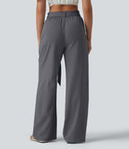 Pantalon décontracté effet lin taille haute, coupe droite, ceinturé avec finitions ondulées et poches
