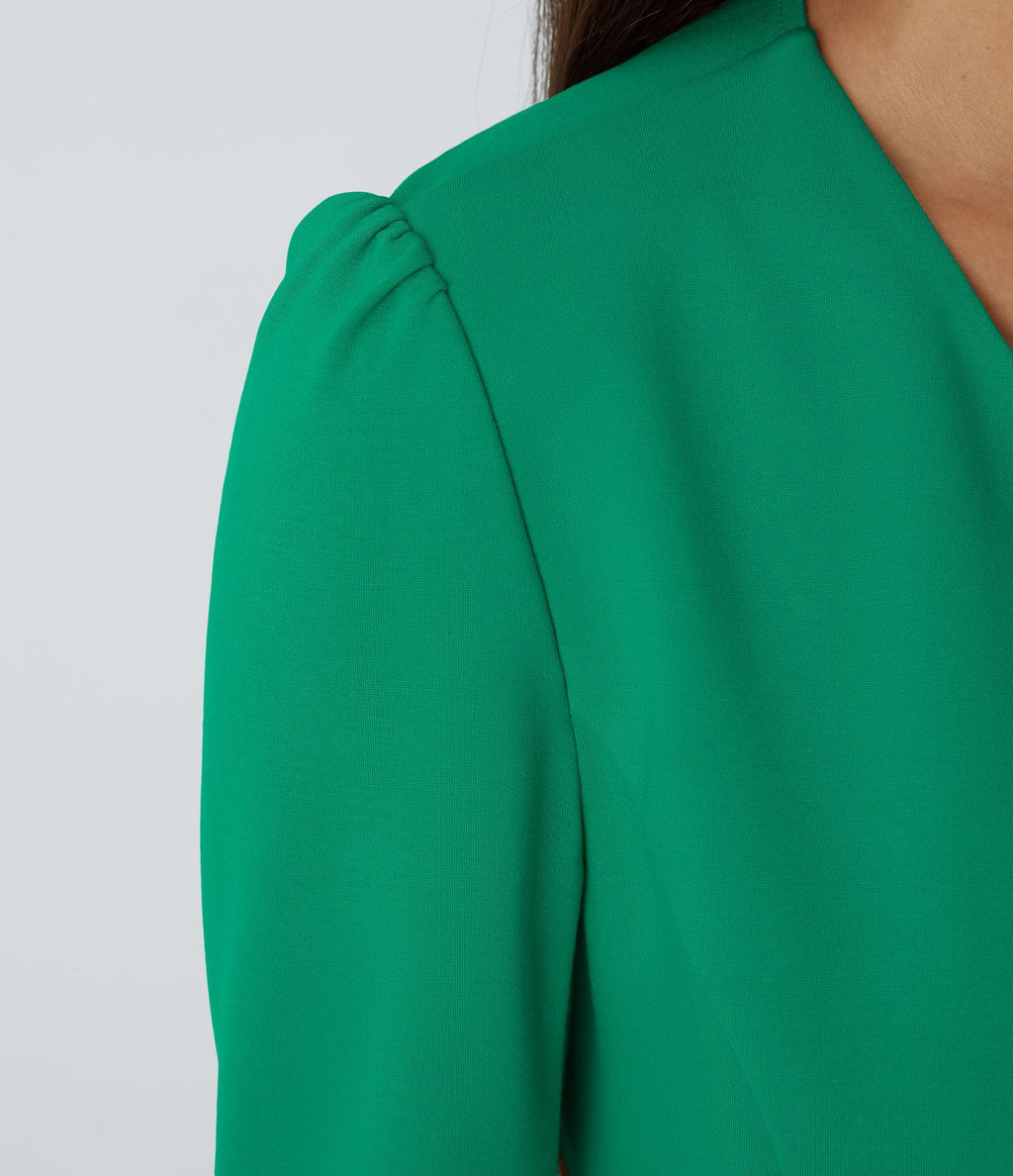 Blazer tailleur ajusté à col rond, manches longues avec boutons décoratifs