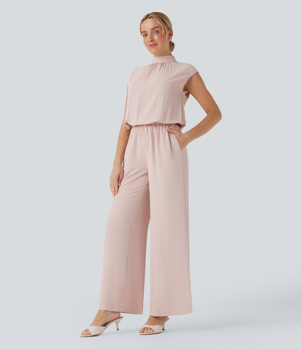 Combinaison pantalon tailleur jambes larges col montant dos goutte d'eau manches courtes avec poches latérales