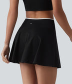 Jupe de tennis mini 2-en-1 color block croisée taille mi-haute avec poches
