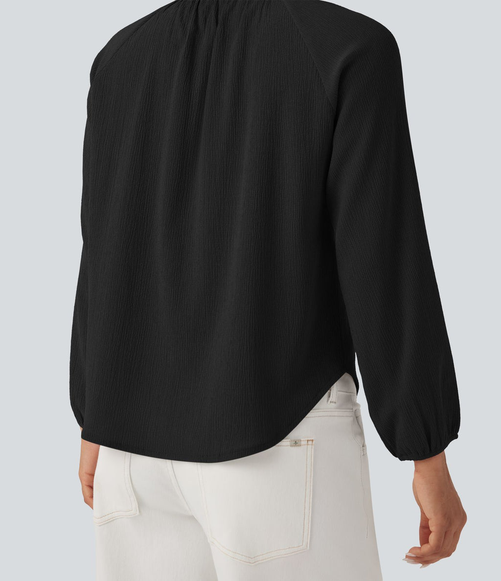 Blouse texturée col rond manches longues ourlet arrondi