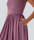 Robe longue fluide fendue avec poches latérales, dos nu et effet torsadé