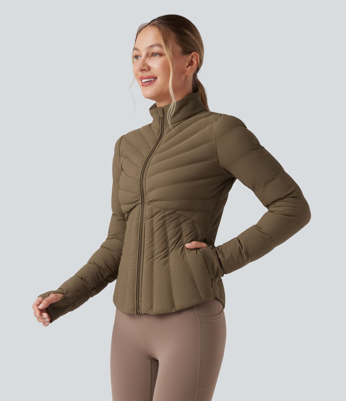 Doudoune de sport extensible col montant avec passants pouces et poches