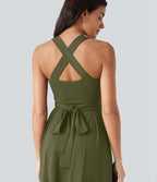 Robe midi fluide sans manches décolleté cœur avec bretelles croisées, nœud dans le dos et poches
