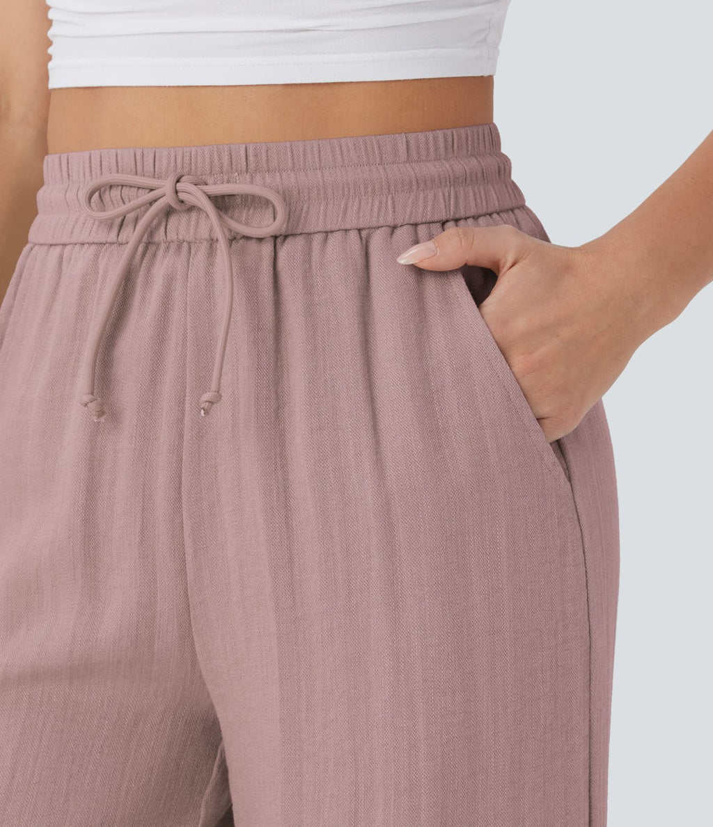 Pantalon large fluide taille haute avec cordon de serrage, poches latérales et aspect lin