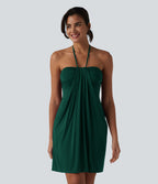 Robe resort mini dos nu à col licou avec lien noué dans le dos et poches