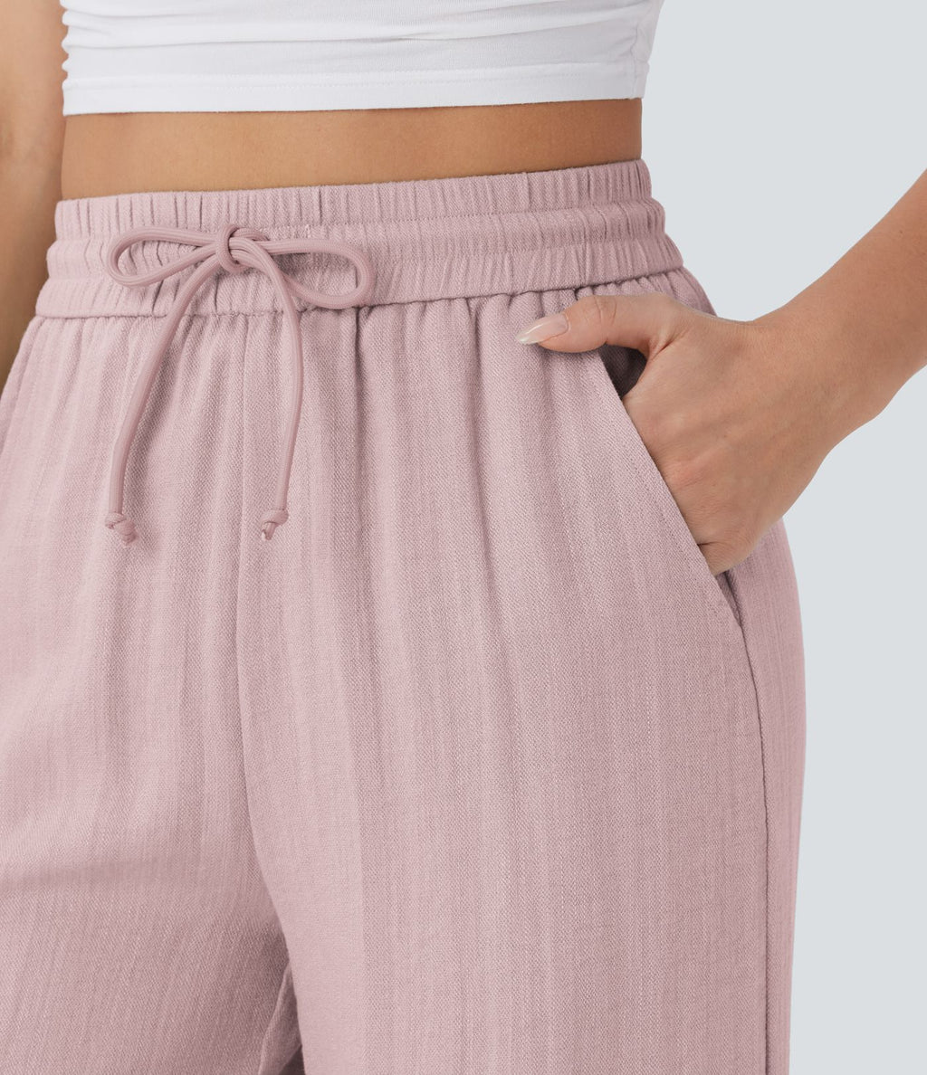 Pantalon large fluide taille haute avec cordon de serrage, poches latérales et aspect lin