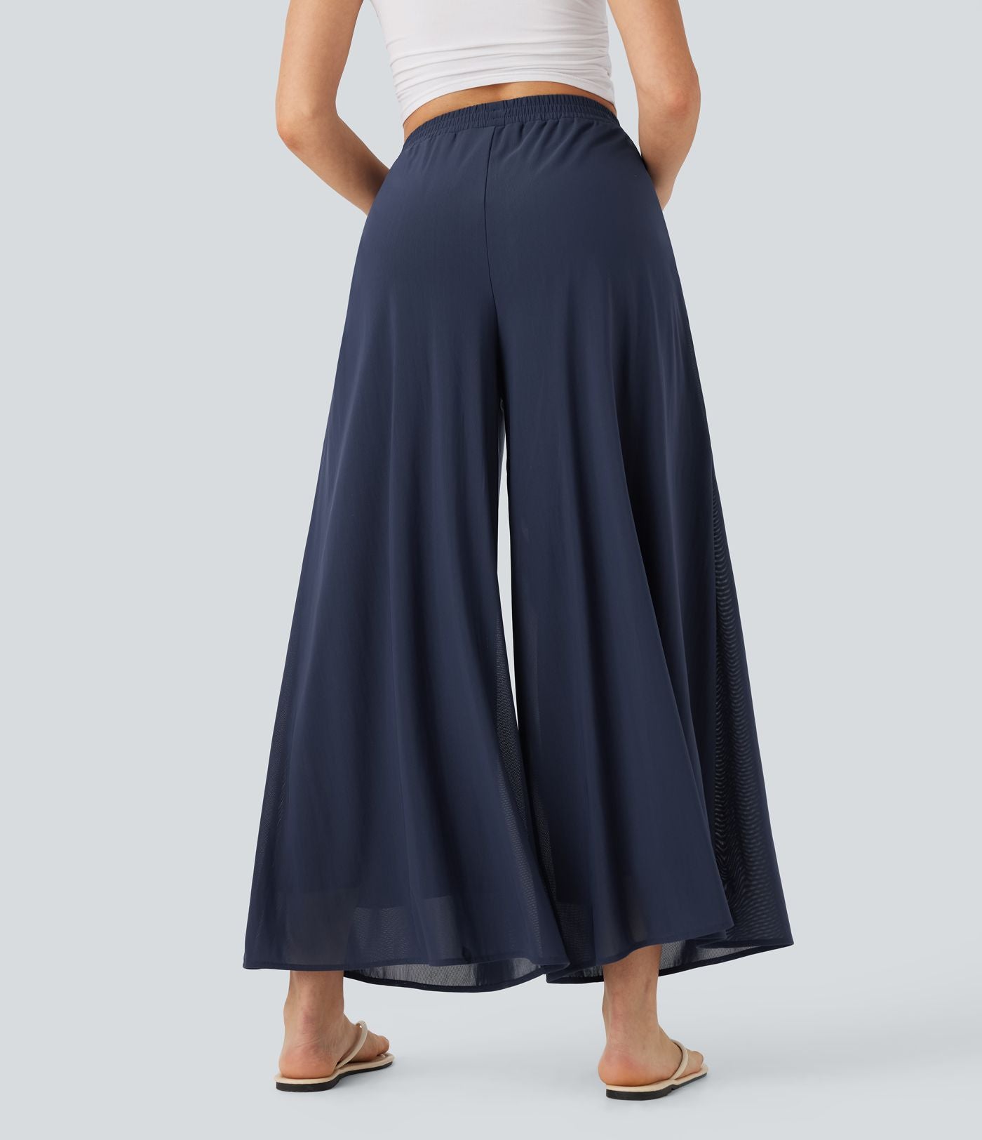 Pantalon fluide et ample avec superposition en mesh, poches latérales et taille haute