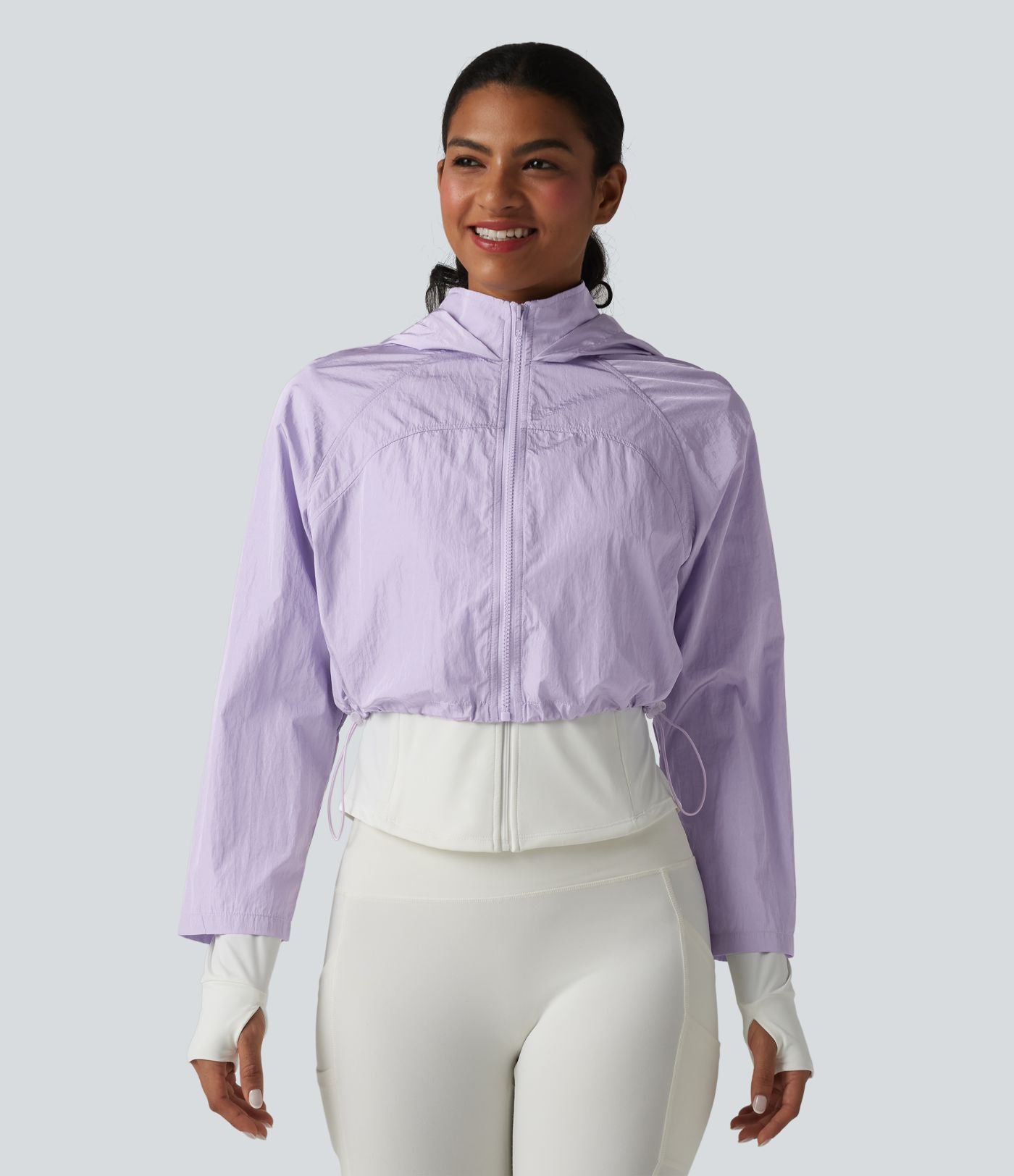 Veste de running 3-en-1 déperlante à capuche avec trous pour les pouces, ourlet arrondi et poches