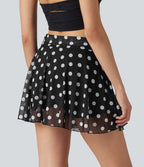 Jupe évasée micro-mini en maille à pois, taille haute, à nouer sur le côté et poche