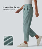 Pantalon tailleur aspect lin fuselé taille haute asymétrique avec poches