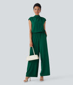 Combinaison pantalon tailleur jambes larges col montant dos goutte d'eau manches courtes avec poches latérales