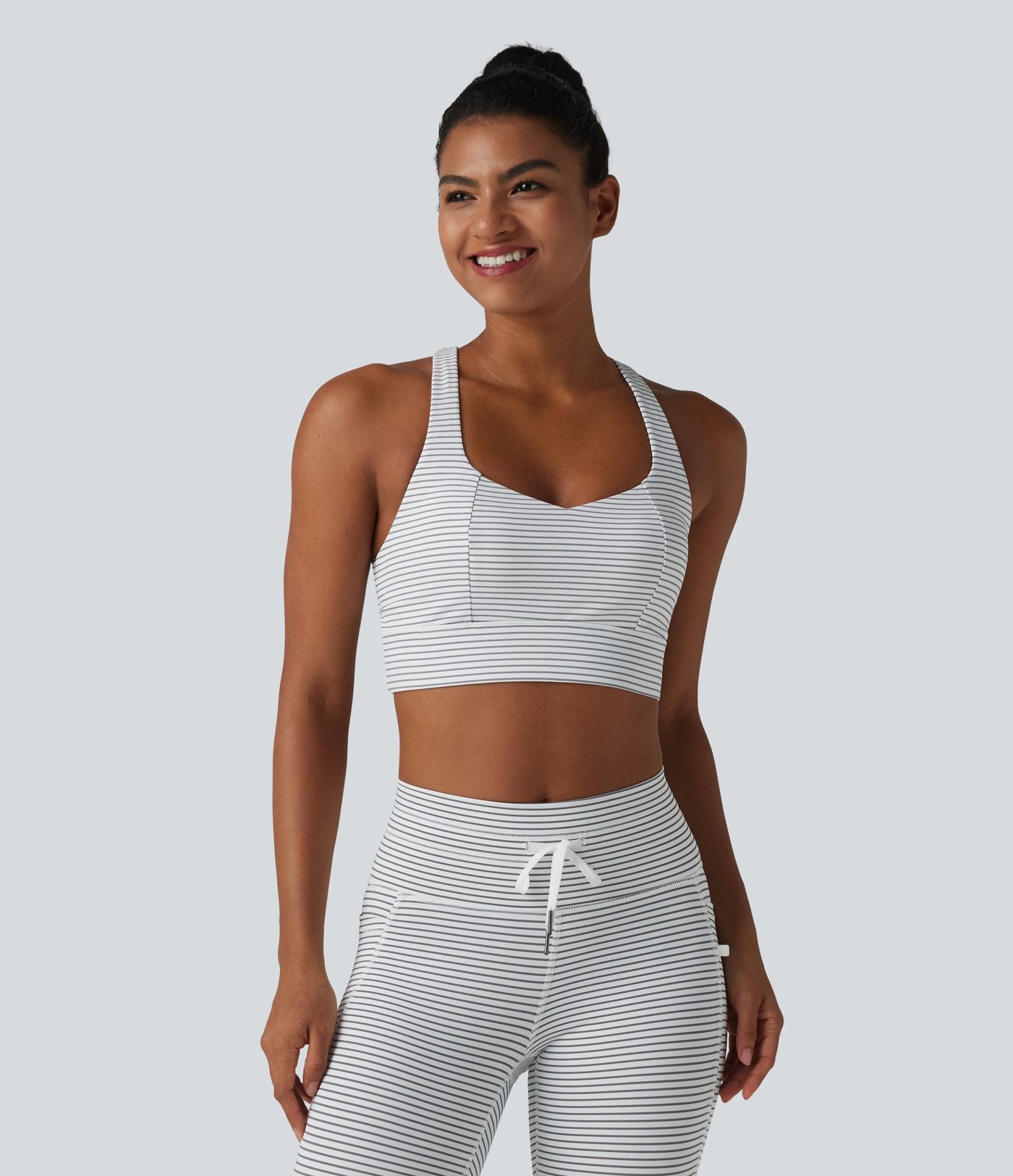 Brassière de sport yoga à rayures dos nageur croisé maintien léger avec soutien-gorge intégré