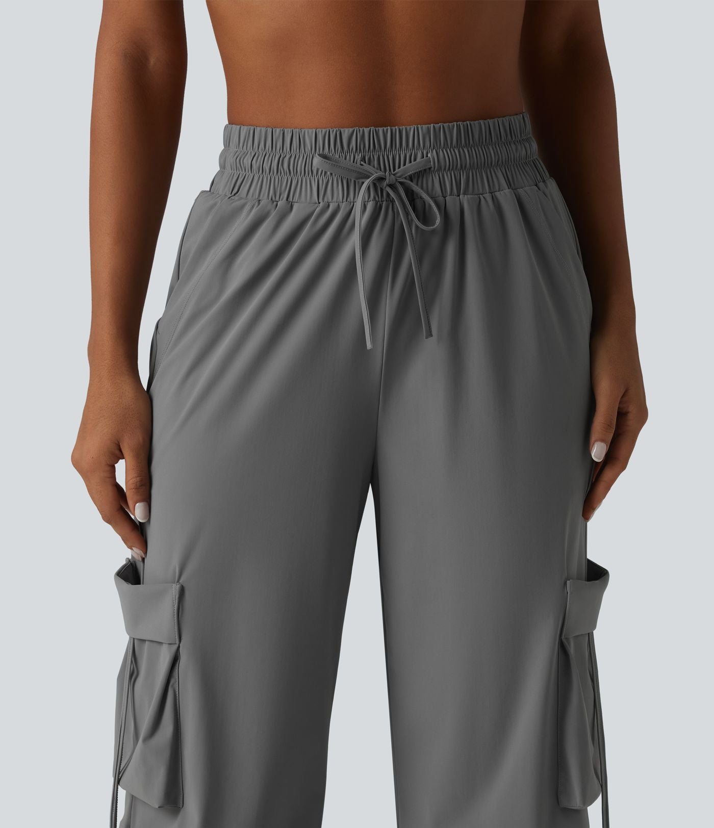 Pantalon cargo large fluide d'entraînement taille haute avec cordon de serrage, séchage rapide, à effet frais InstantCool et poches, protection solaire UPF40+