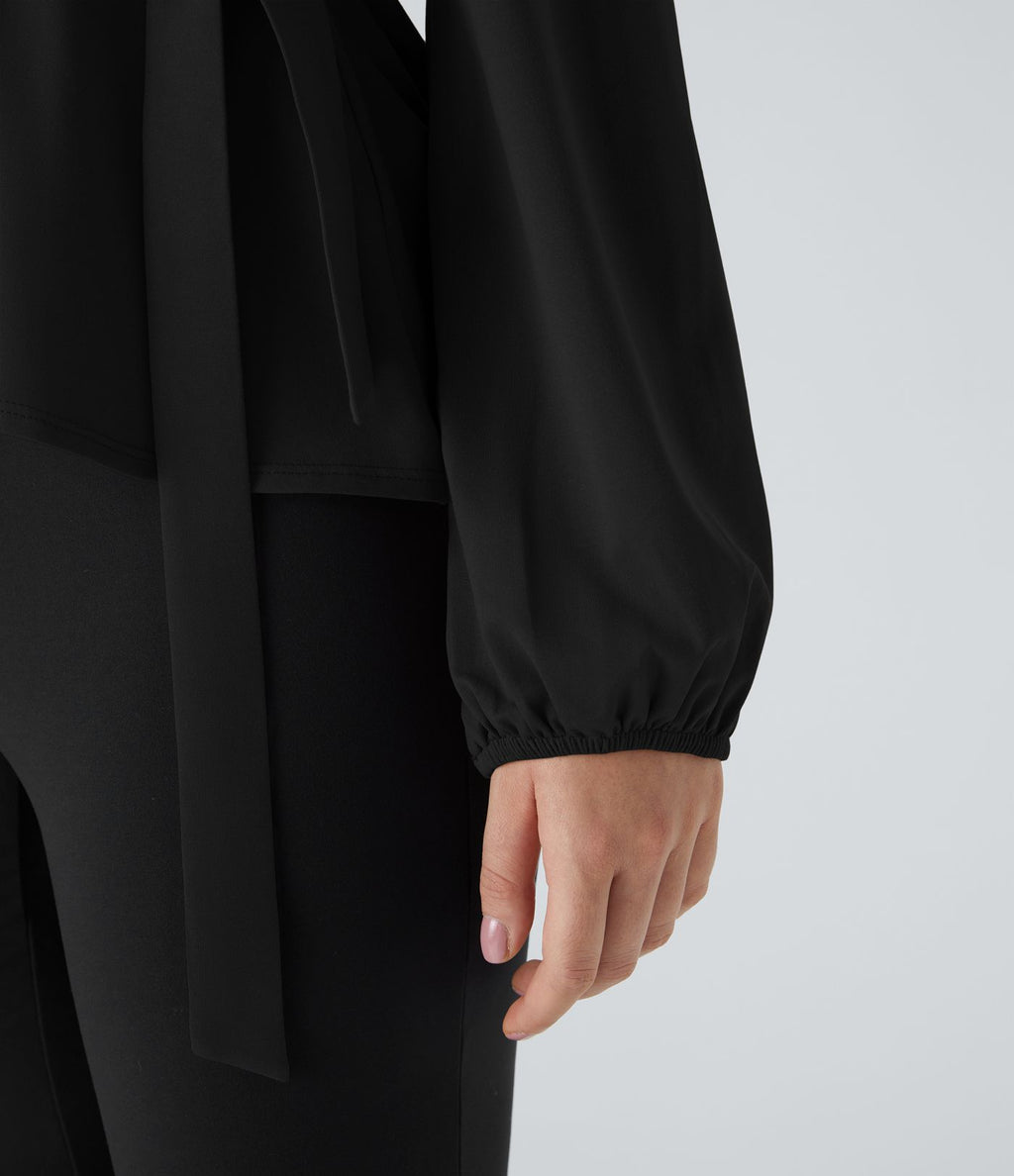 Blouse de travail à col châle, effet cache-cœur, lien sur le côté et ourlet à volants