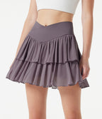Jupe-short tennis mini fluide taille haute croisée en mesh à volants, avec poches