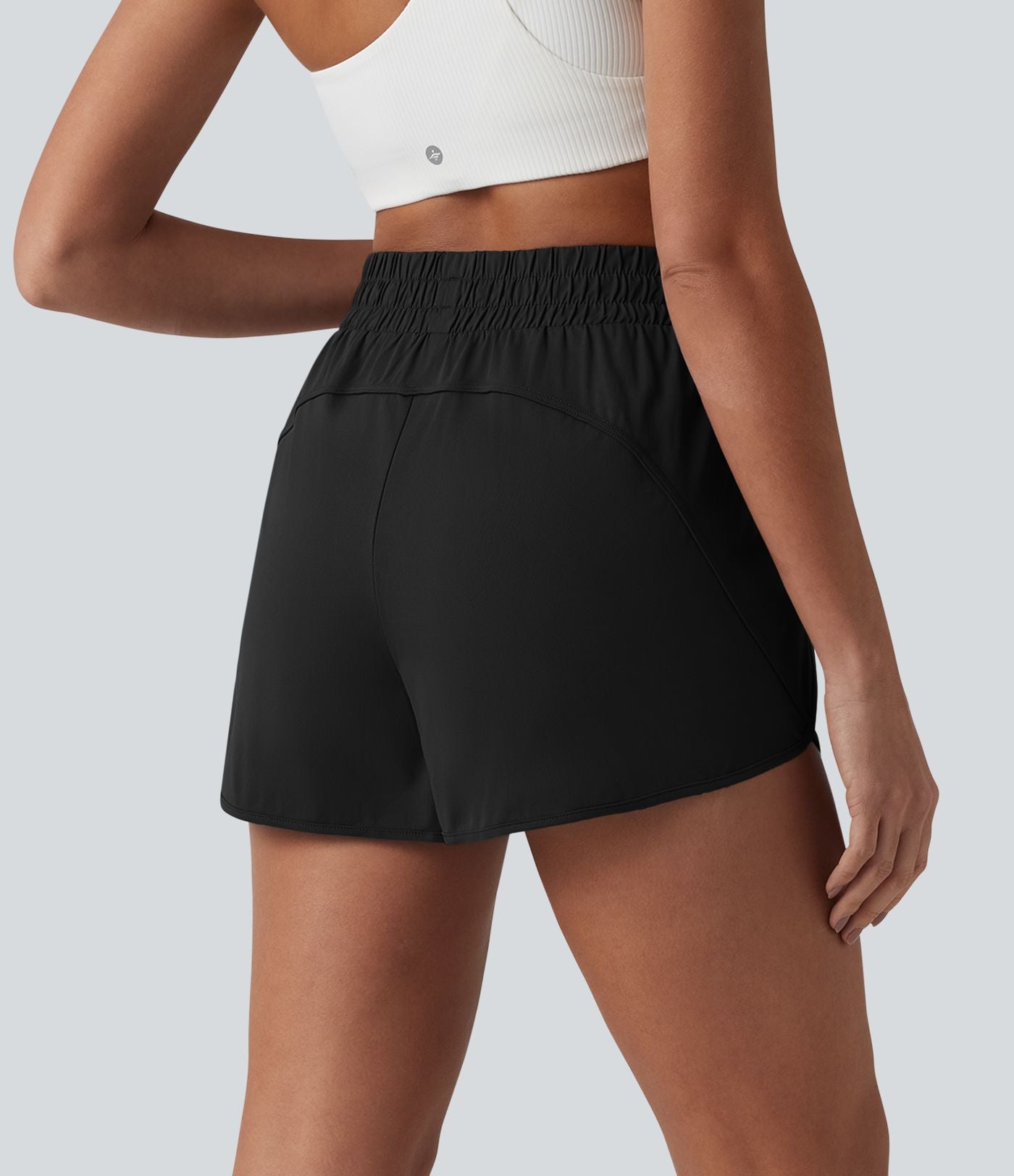 Short de yoga 7,5 cm taille haute à ourlet arrondi et poches