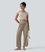 Pantalon décontracté taille haute gainant avec ourlet arrondi et poches