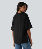 T-shirt décontracté col rond manches retroussées avec ourlet fendu