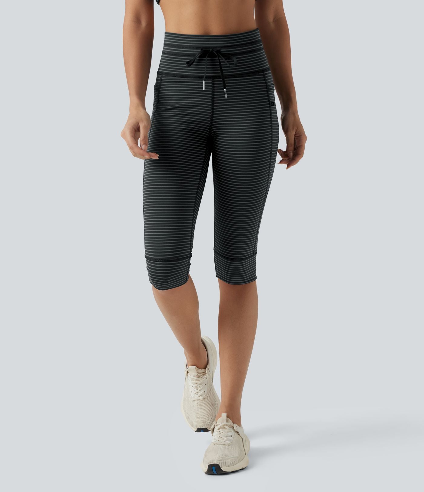 Legging 3/4 de yoga taille haute à rayures avec cordon de serrage et poches