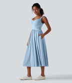 Robe midi fluide sans manches dos croisé ouvert avec poches