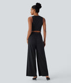 Combinaison tailleur rayée à jambes larges, décolleté en V, découpe et poches