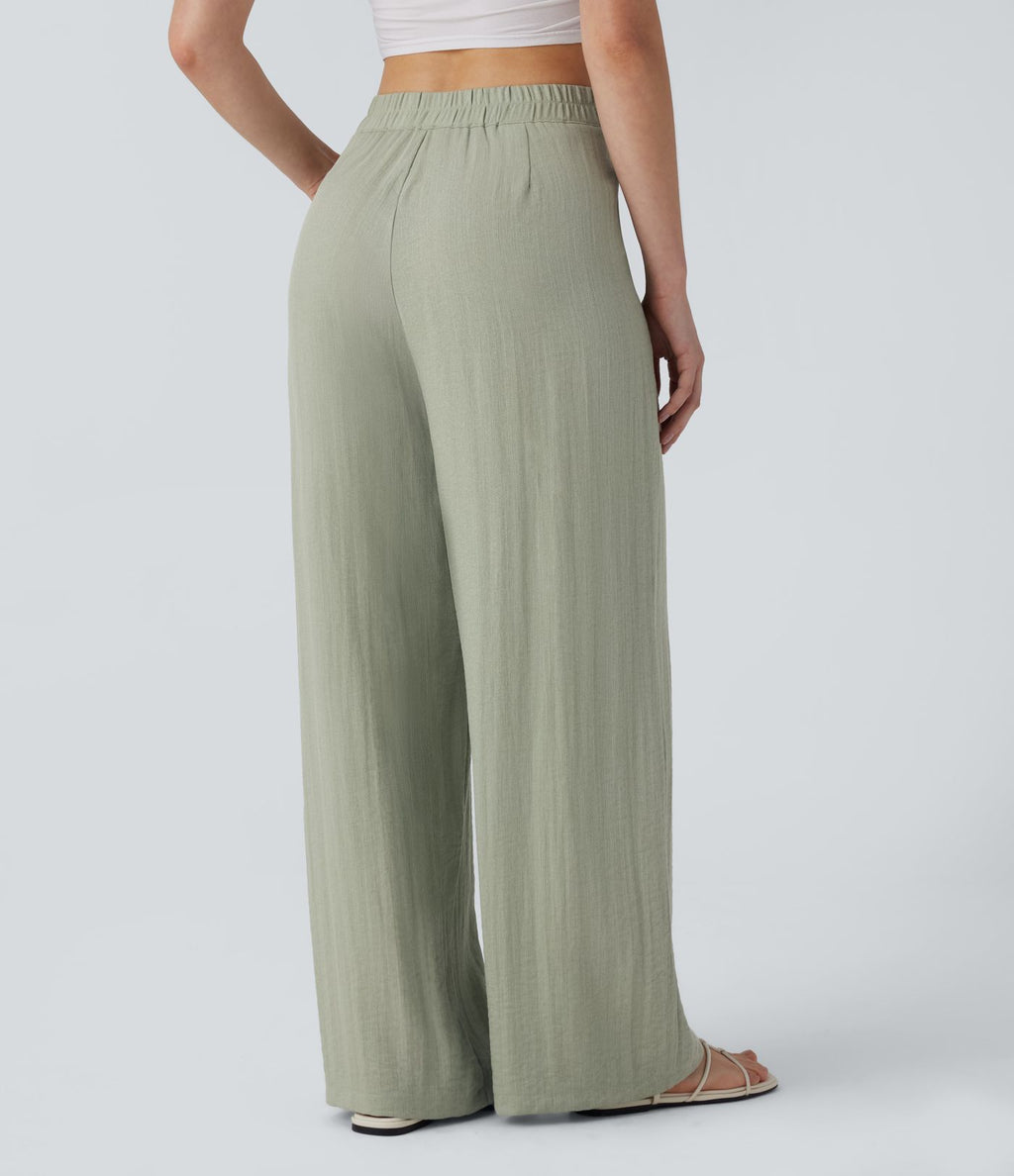 Pantalon large et fluide aspect lin taille haute, boutonné avec poches