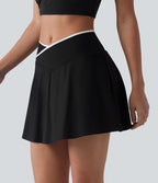 Jupe de tennis mini 2-en-1 color block croisée taille mi-haute avec poches