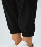 Pantalon décontracté en velours côtelé avec taille mi-haute, boutons et fermeture éclair