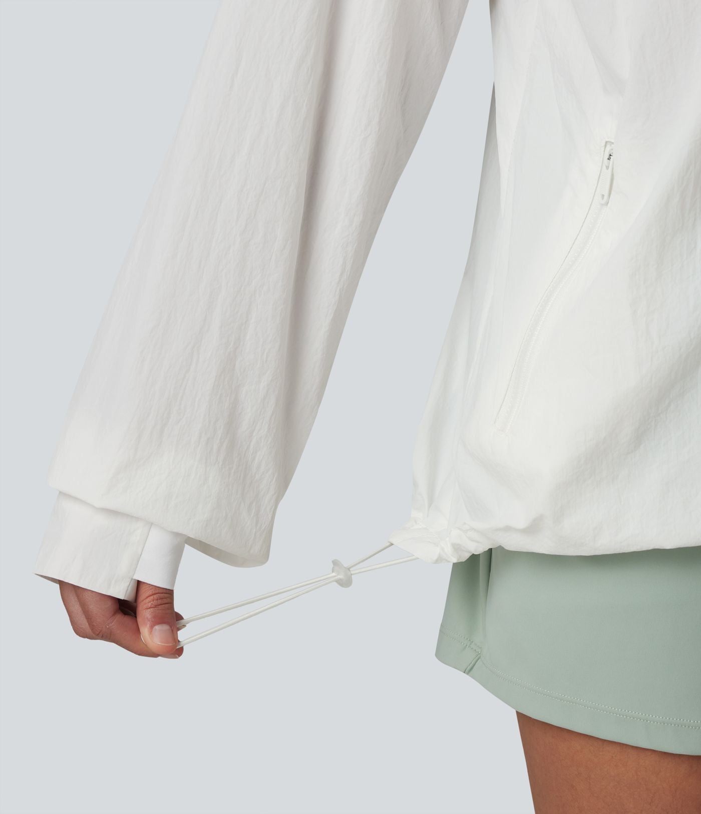 Coupe-vent casual à col droit avec trou pouces, cordon de serrage et poches