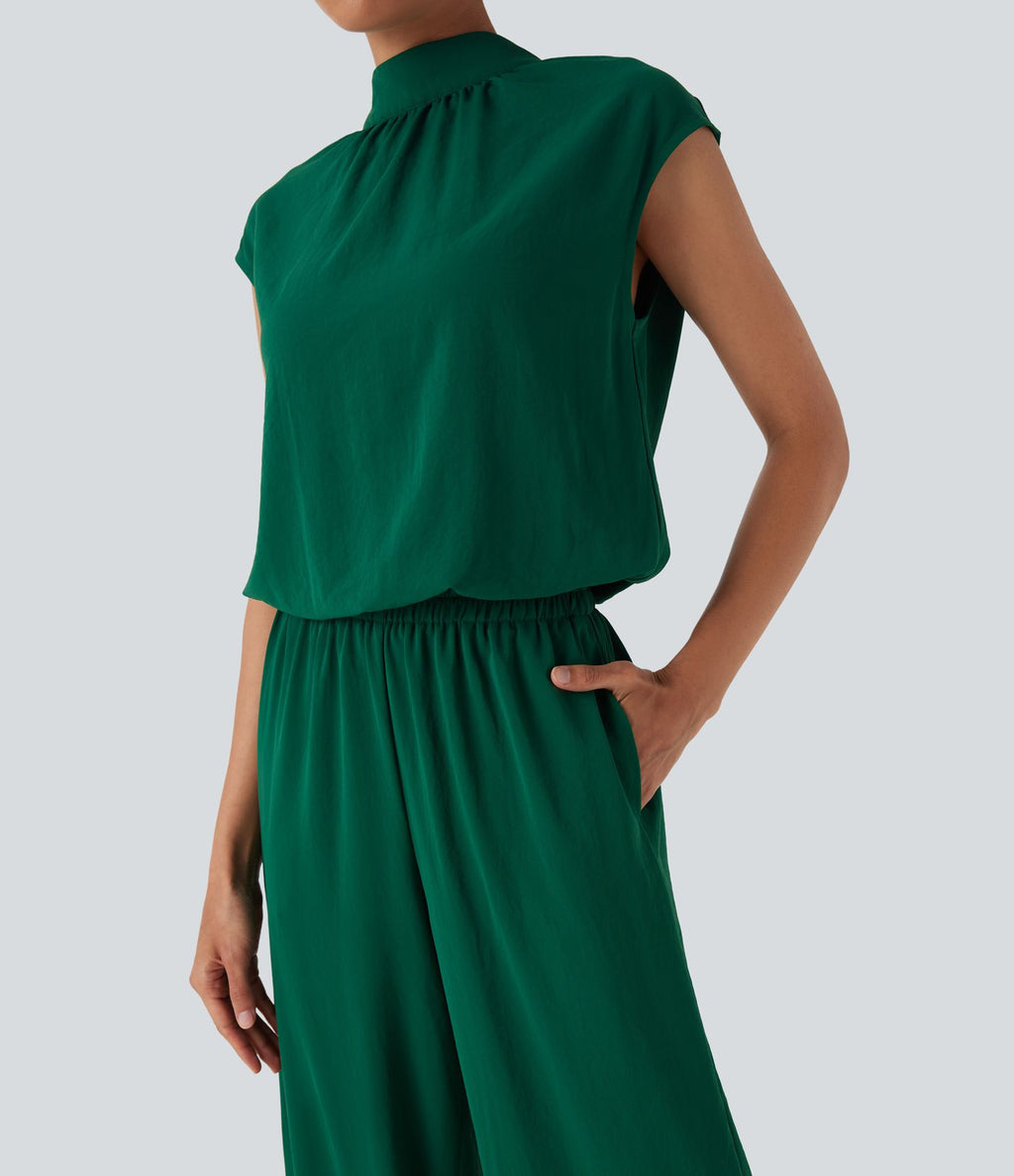 Combinaison pantalon tailleur jambes larges col montant dos goutte d'eau manches courtes avec poches latérales