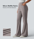 Pantalon décontracté bootcut taille haute en tissu micro-gaufré avec poches
