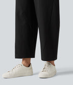 Pantalon décontracté à taille mi-haute, coupe ample et jambes fuselées, avec poches