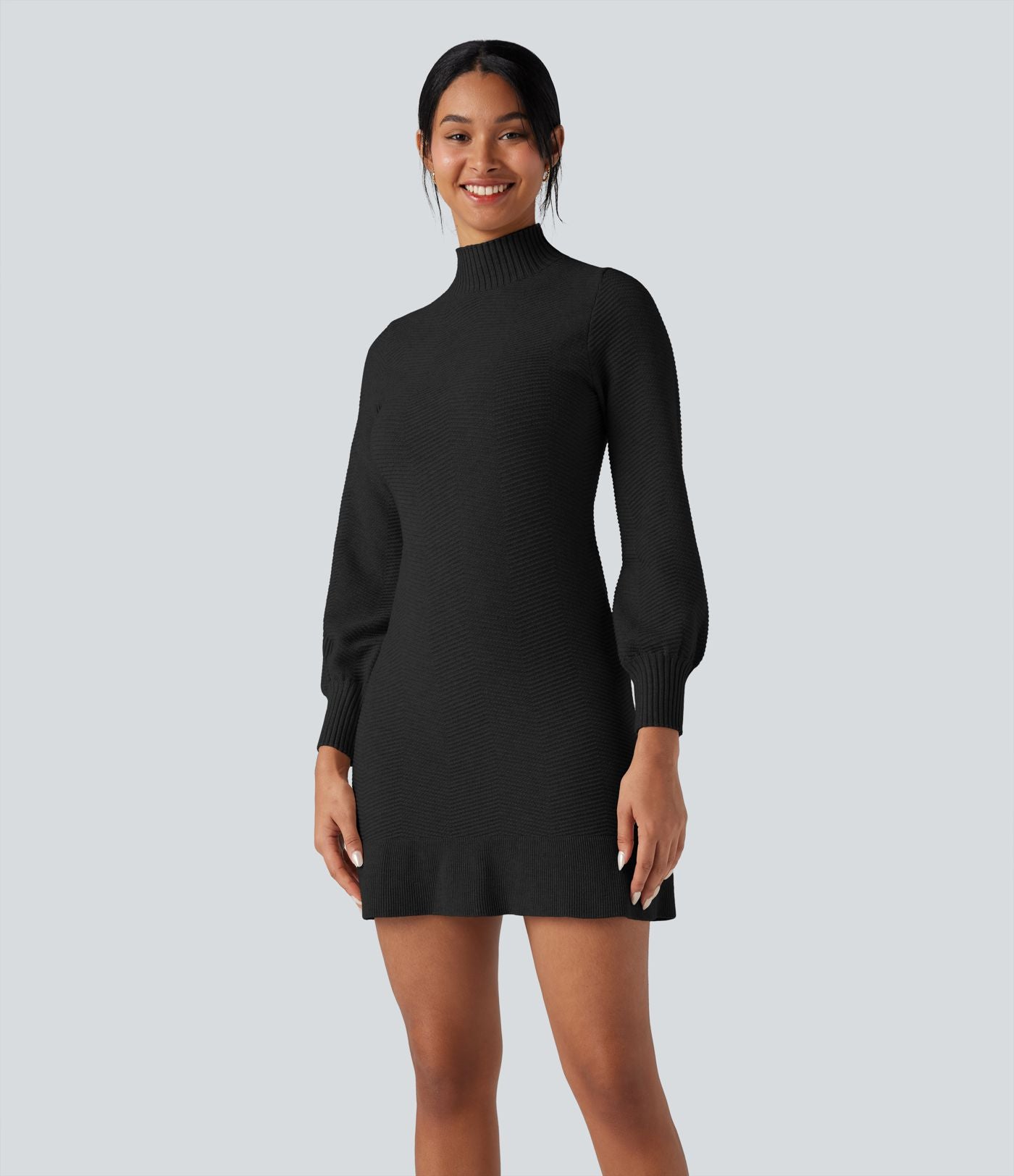 Robe pull courte col montant manches longues ourlet à volants