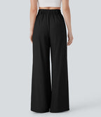 Pantalon large fluide effet lin taille moyenne avec poches