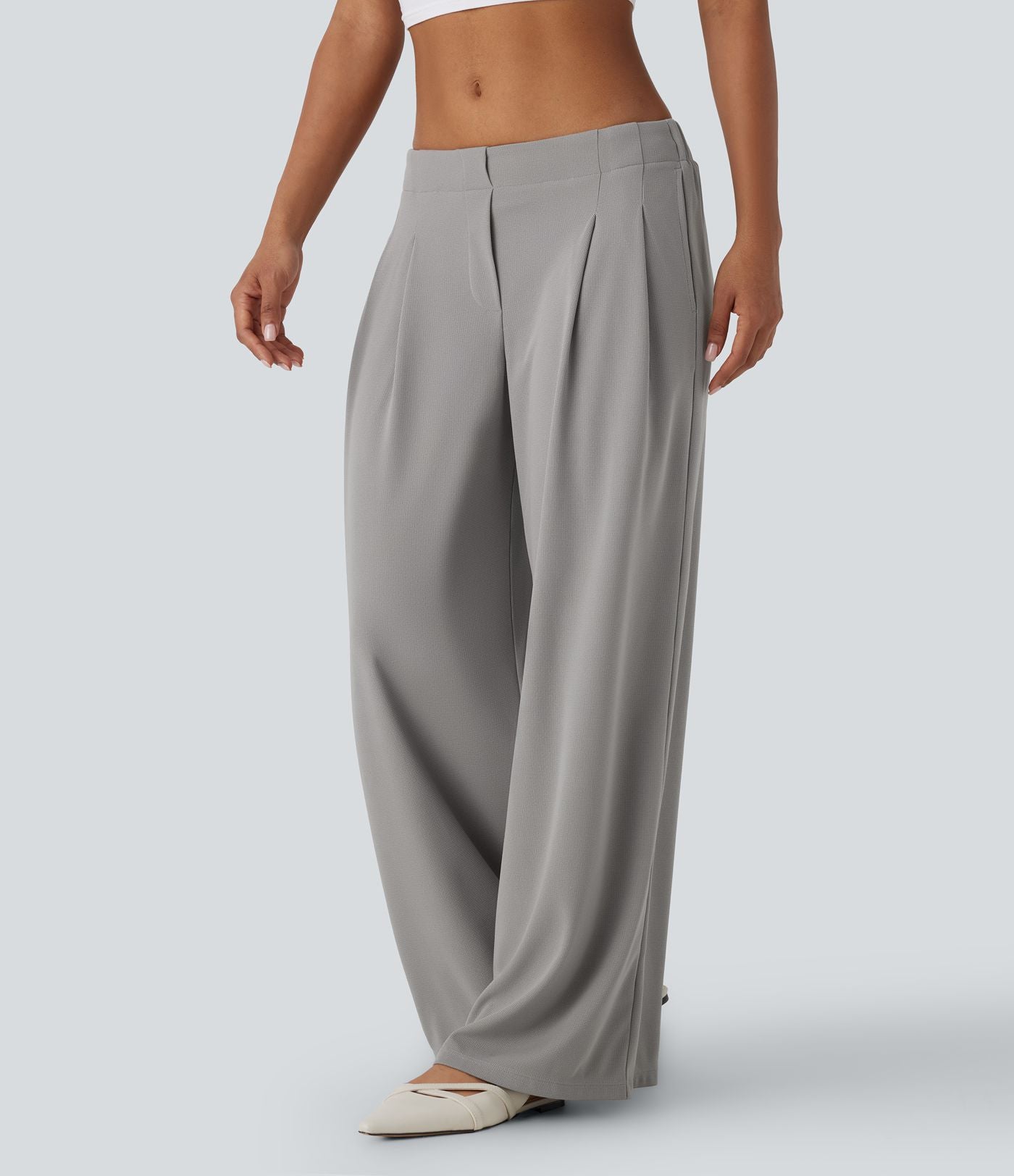 Pantalon décontracté taille basse à jambes larges en tissu gaufré avec poches latérales