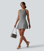 Robe mini habillée col bateau sans manches à rayures et détails plissés