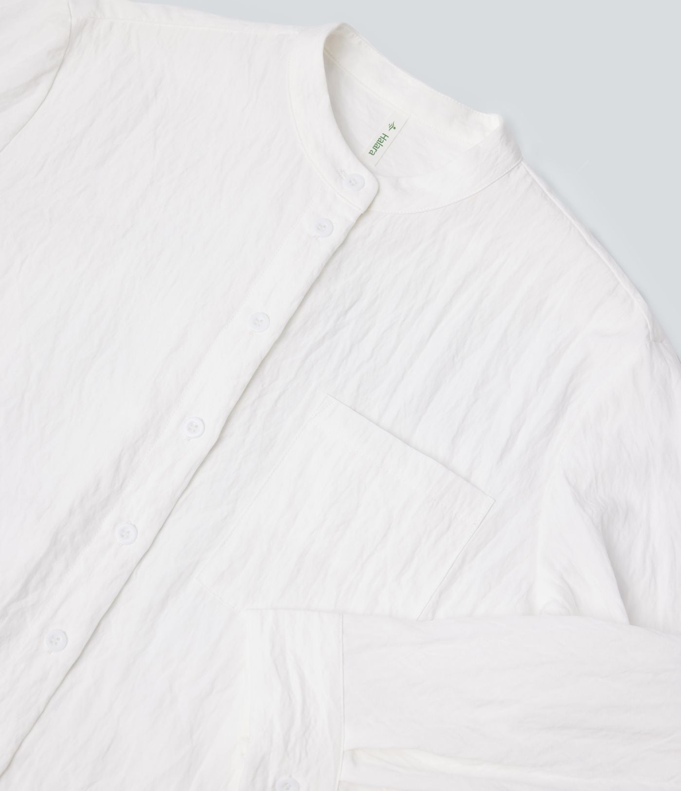 Chemise décontractée manches longues ourlet arrondi avec poche