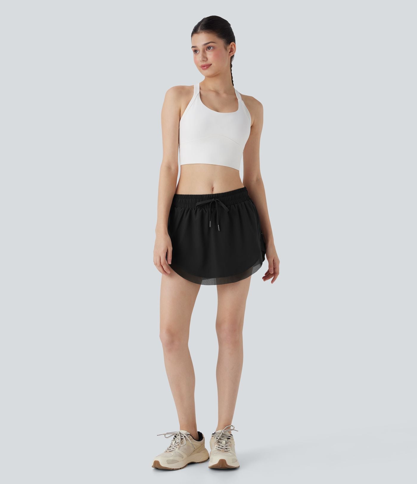 Mini-jupe de tennis 2-en-1 taille moyenne avec cordon de serrage, filet contrasté et poches latérales