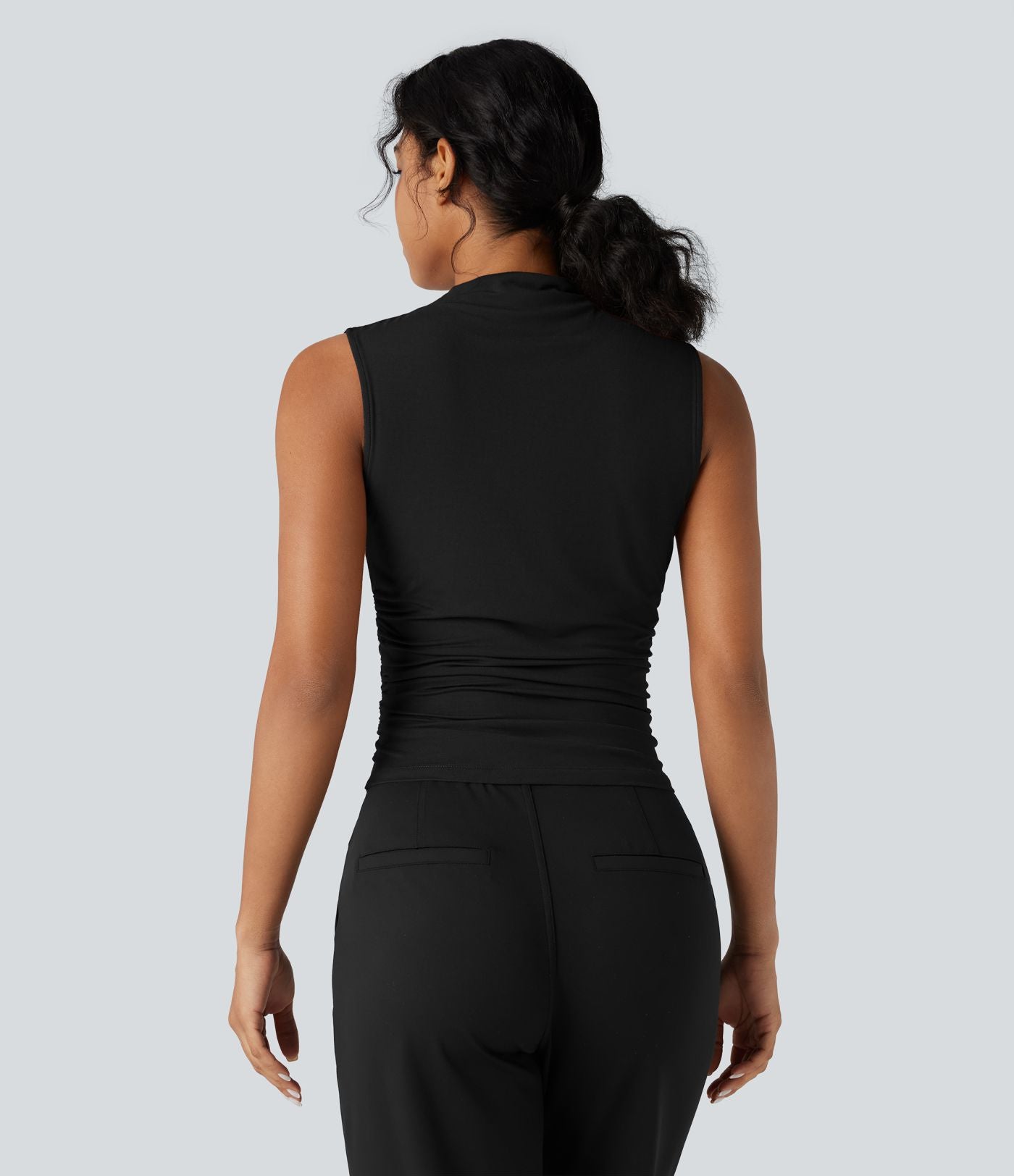 Top tailleur froncé col montant sans manches