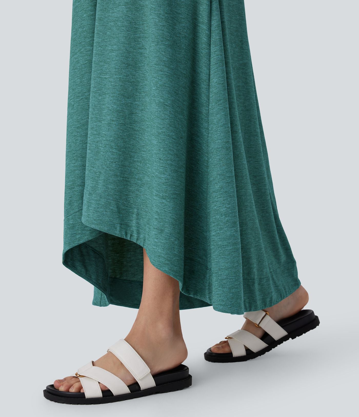 Robe longue décontractée fluide à col rond, sans manches, poches latérales et ourlet asymétrique