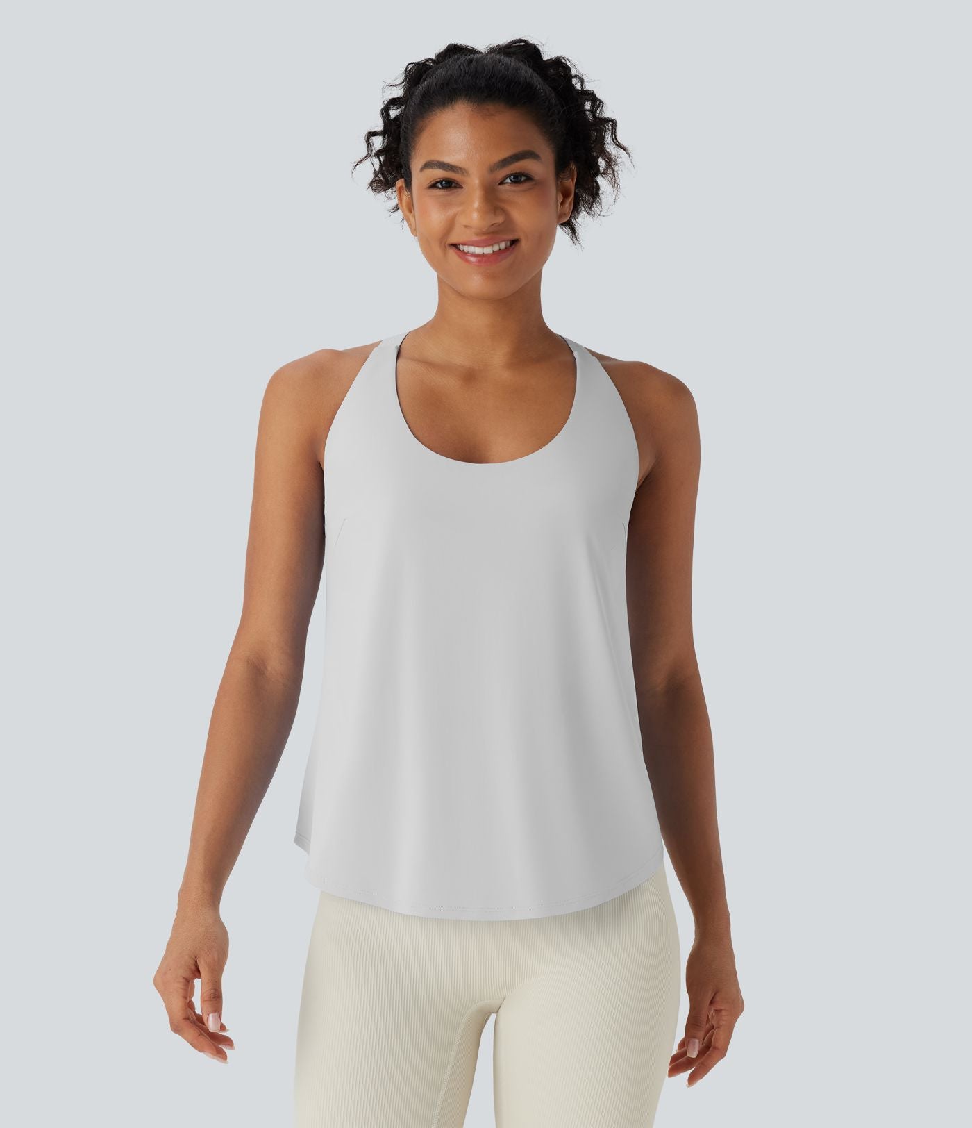 Débardeur yoga dos nu col U avec bretelles croisées, ourlet arrondi et effet frais InstantCool, protection solaire UPF50+